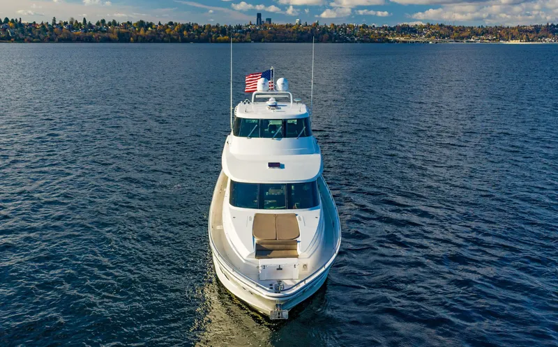 Slide: The Image of 2006 Horizon 82’ Cockpit Motoryacht on open water. - 2