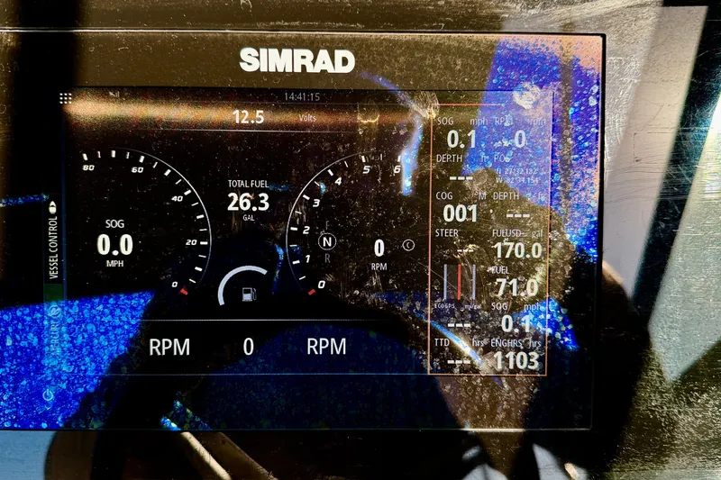 Slide: The Image of Simrad display on 2022 Sea Ray SPX 210 Outboard showing fuel and navigation data. - 18