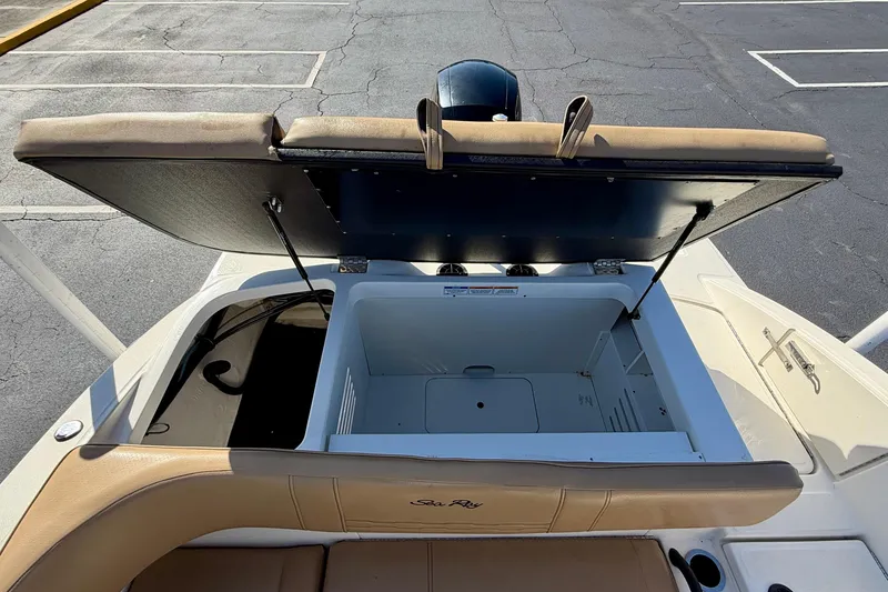 Slide: The Image of 2022 Sea Ray SPX 210 Outboard boat with open storage compartment. - 28