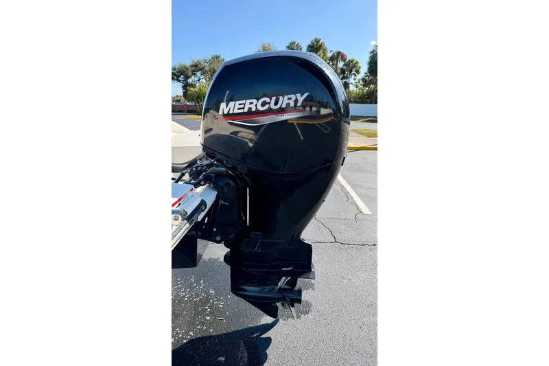 Slide: The Image of 2022 Sea Ray SPX 210 Outboard with Mercury engine in a parking lot. - 29