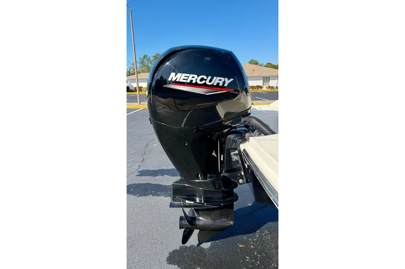 Slide: The Image of Mercury outboard motor on 2022 Sea Ray SPX 210 boat, parked outdoors. - 31