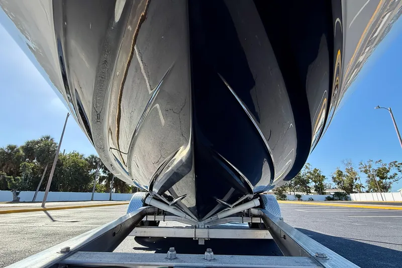 Slide: The Image of 2022 Sea Ray SPX 210 Outboard boat hull on trailer, viewed from below. - 32