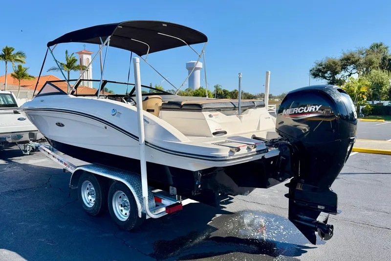 Slide: The Image of 2022 Sea Ray SPX 210 Outboard boat on trailer, featuring Mercury engine. - 5