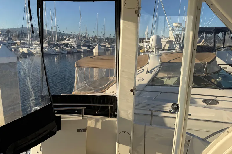 Slide: The Image of 2007 Meridian 459 Motoryacht docked at a marina with clear skies. - 10