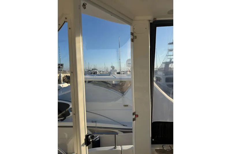 Slide: The Image of 2007 Meridian 459 Motoryacht view from interior, overlooking marina. - 11