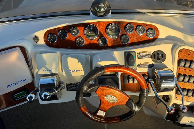 Slide: The Image of 2007 Meridian 459 Motoryacht dashboard with Northstar navigation and wood accents. - 14