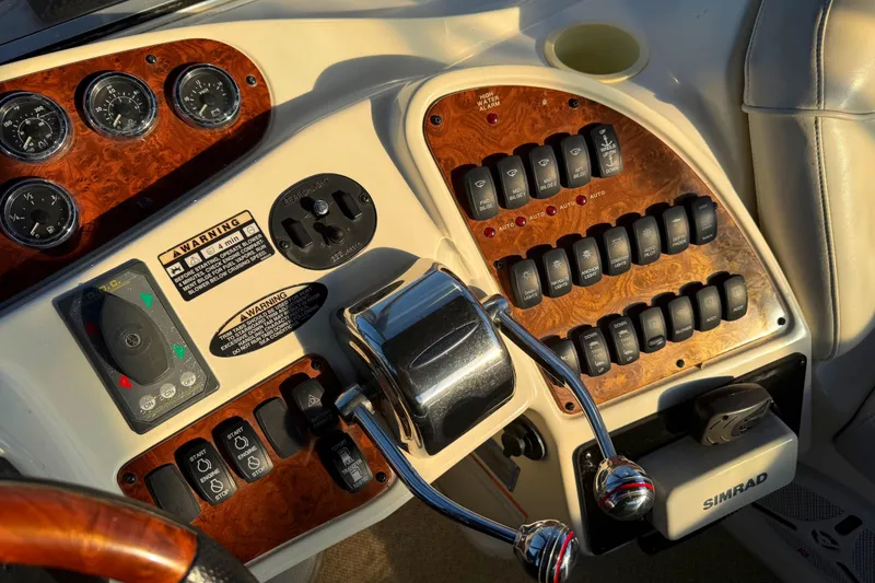 Slide: The Image of 2007 Meridian 459 Motoryacht dashboard with controls and gauges in sunlight. - 16