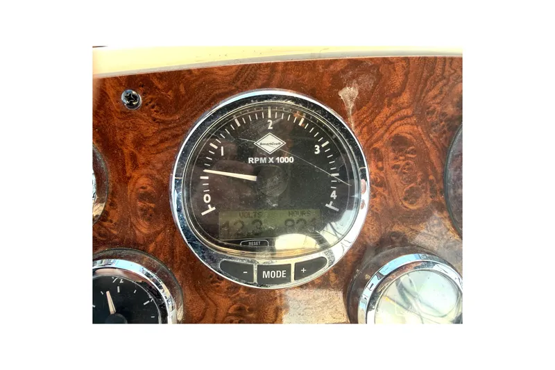 Slide: The Image of Dashboard of 2007 Meridian 459 Motoryacht with RPM gauge and wood finish. - 17