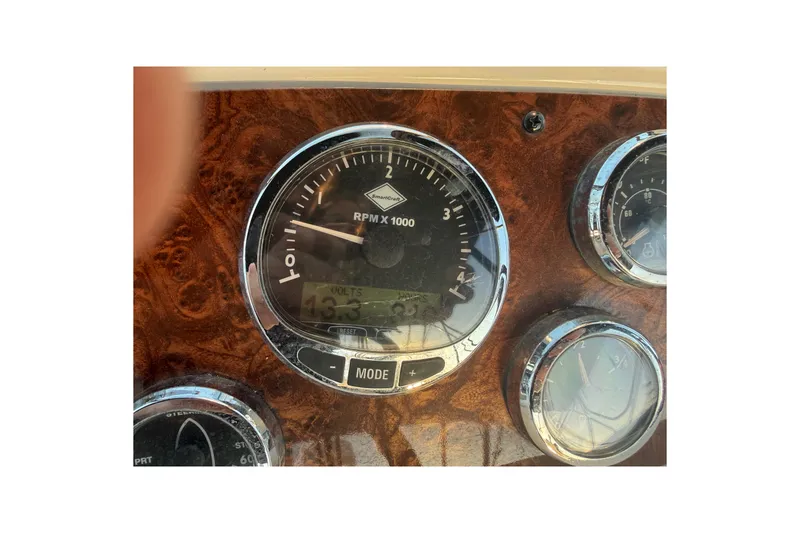 Slide: The Image of Dashboard of 2007 Meridian 459 Motoryacht showing RPM and voltage gauges. - 18