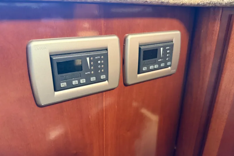 Slide: The Image of Digital control panels on 2007 Meridian 459 Motoryacht's wooden interior. - 24