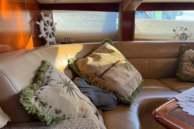 Slide: The Image of Luxurious 2007 Meridian 459 Motoryacht interior with plush seating and decorative pillows. - 27