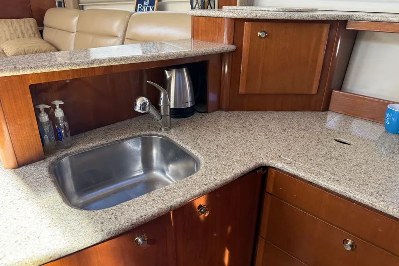 Slide: The Image of Luxurious 2007 Meridian 459 Motoryacht kitchen with granite countertops and stainless steel sink. - 31