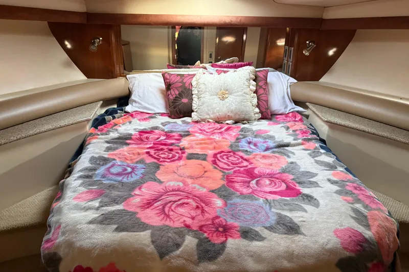 Slide: The Image of Cozy bedroom in 2007 Meridian 459 Motoryacht with floral bedding and decorative pillows. - 32