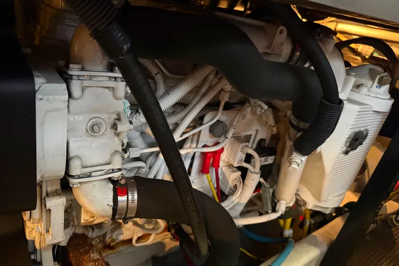 Slide: The Image of Engine compartment of a 2007 Meridian 459 Motoryacht, showcasing intricate mechanical components. - 37