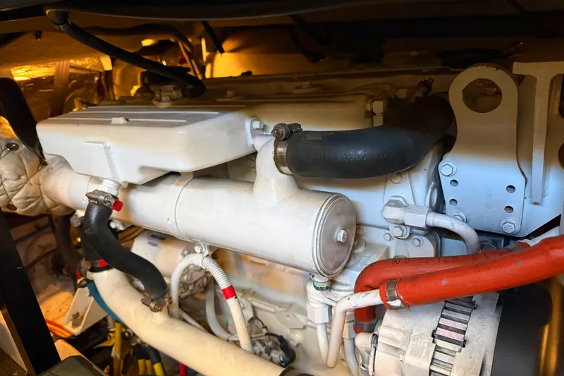 Slide: The Image of Engine compartment of a 2007 Meridian 459 Motoryacht, showcasing detailed mechanical components. - 38