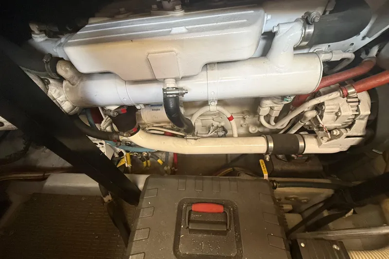 Slide: The Image of Engine compartment of a 2007 Meridian 459 Motoryacht, showcasing mechanical components and wiring. - 43