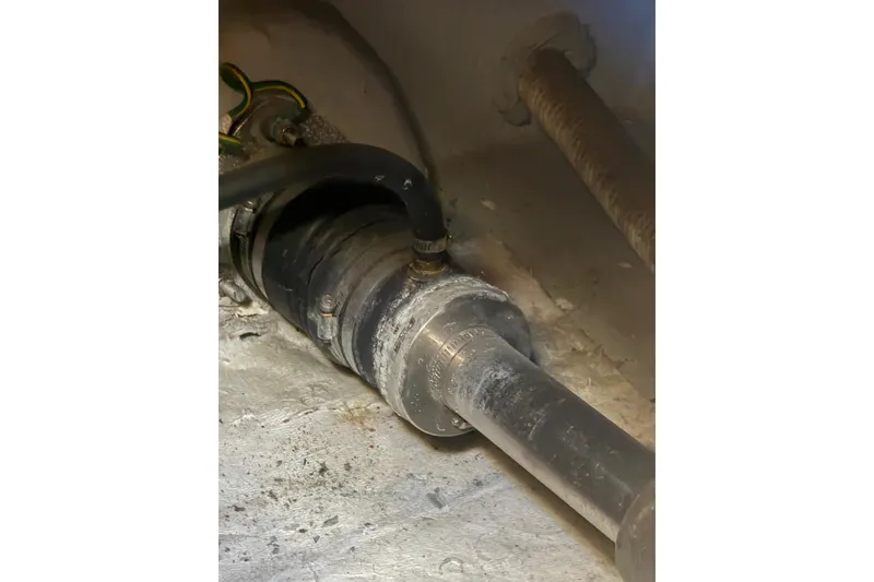 Slide: The Image of 2007 Meridian 459 Motoryacht engine component with hoses and fittings. - 45