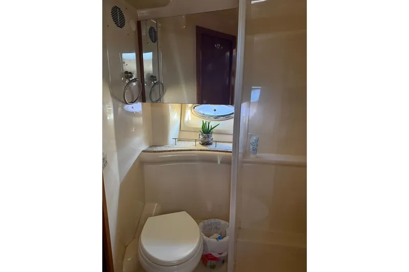 Slide: The Image of Bathroom interior of 2007 Meridian 459 Motoryacht with toilet and porthole window. - 47