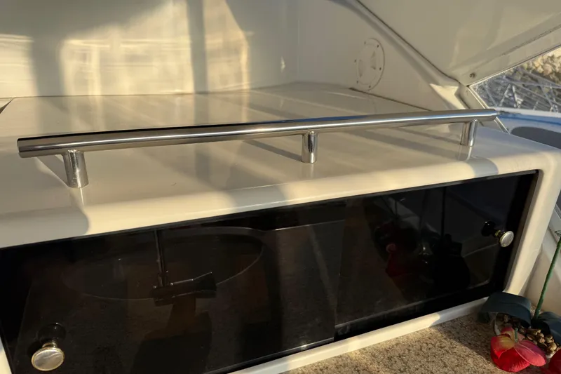 Slide: The Image of 2007 Meridian 459 Motoryacht interior detail with stainless steel handle and storage compartment. - 49