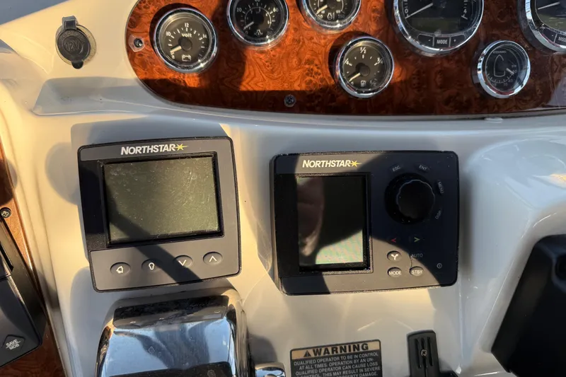 Slide: The Image of Control panel of a 2007 Meridian 459 Motoryacht with Northstar navigation displays. - 50