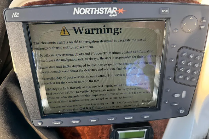 Slide: The Image of Northstar 6100i navigation system displaying a warning message on a 2007 Meridian 459 Motoryacht. - 54