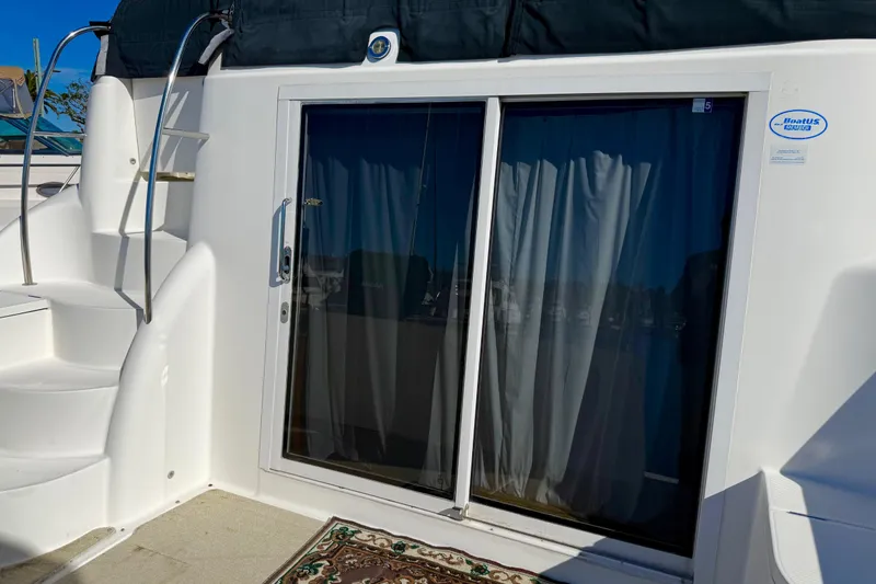 Slide: The Image of 2007 Meridian 459 Motoryacht with sliding glass door and spiral staircase. - 55