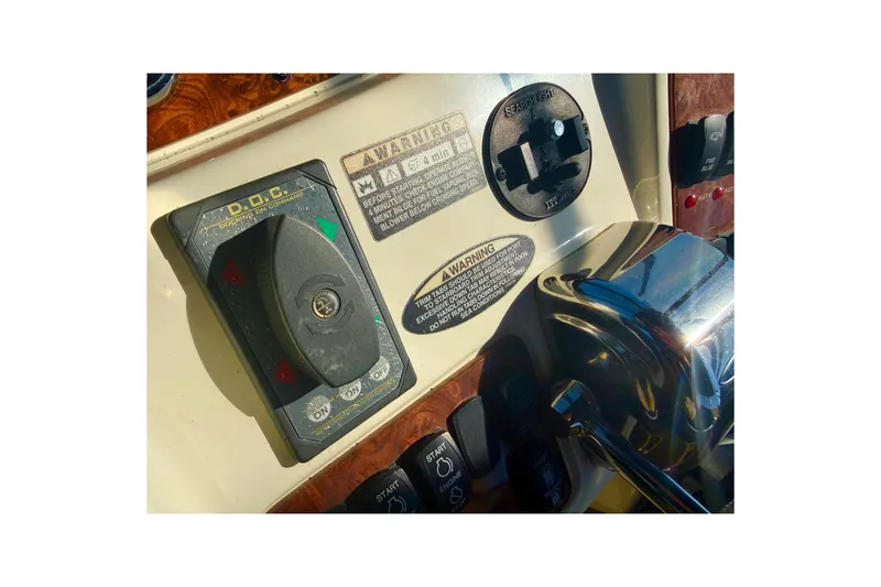 Slide: The Image of Control panel of 2007 Meridian 459 Motoryacht with various switches and warnings. - 56