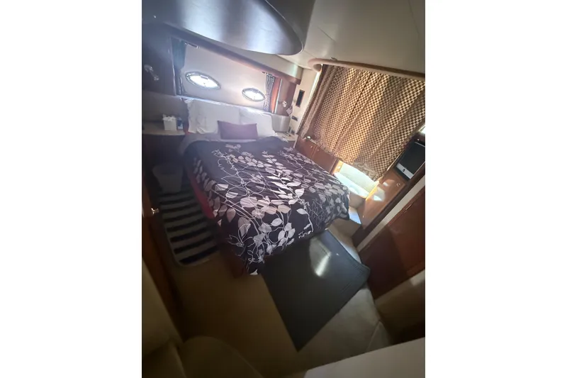 Slide: The Image of Luxurious bedroom interior of 2007 Meridian 459 Motoryacht with floral bedding and elegant decor. - 58