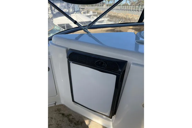 Slide: The Image of 2007 Meridian 459 Motoryacht interior with compact refrigerator and window view. - 61