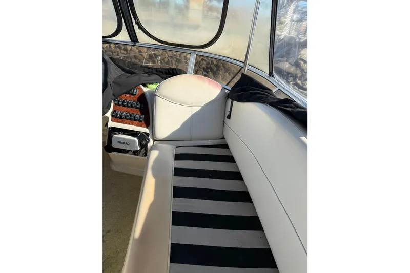 Slide: The Image of Interior of 2007 Meridian 459 Motoryacht with striped seating and navigation equipment. - 63