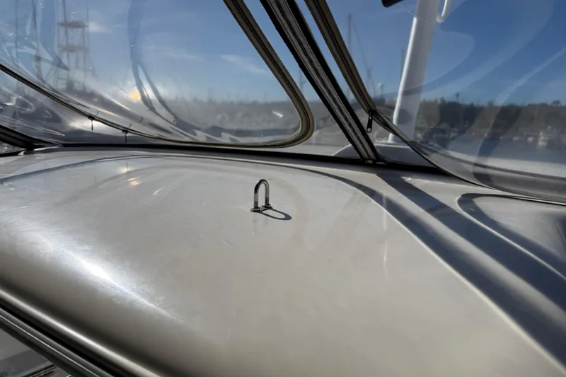 Slide: The Image of Close-up of 2007 Meridian 459 Motoryacht deck with clear canopy and metal fitting. - 64