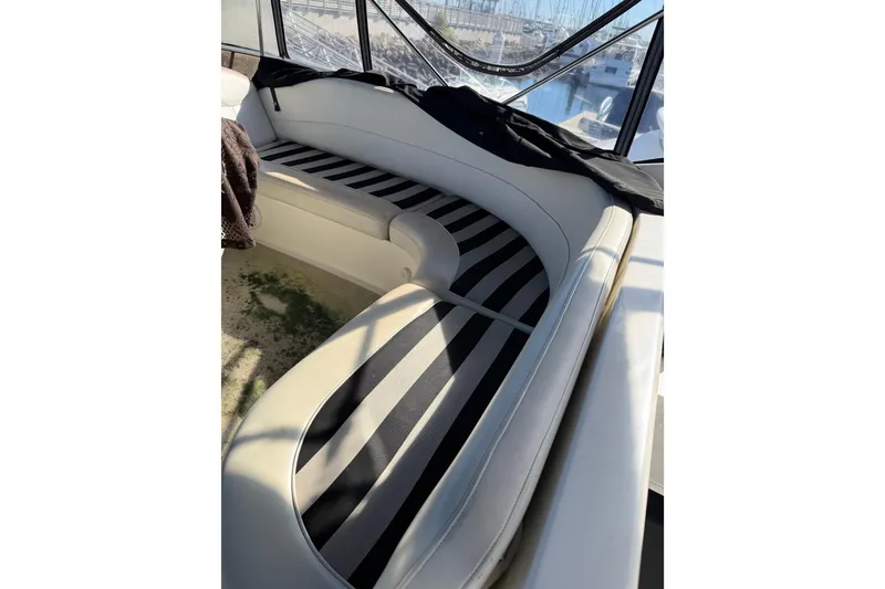 Slide: The Image of Luxurious seating area on 2007 Meridian 459 Motoryacht with striped cushions. - 65