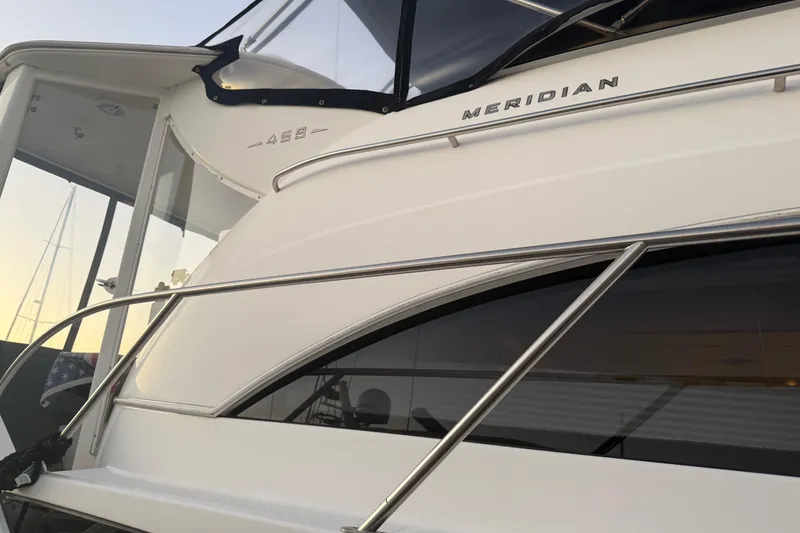 Slide: The Image of 2007 Meridian 459 Motoryacht, sleek design with polished railings and modern windows. - 7
