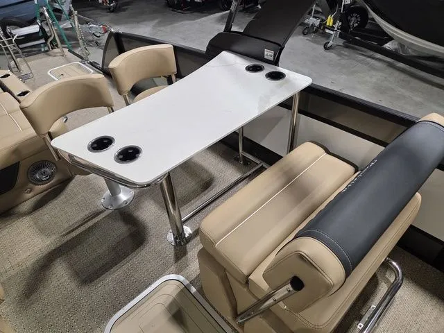 Slide: The Image of Interior of 2026 Barletta Lusso 25UE with table and seating. - 19