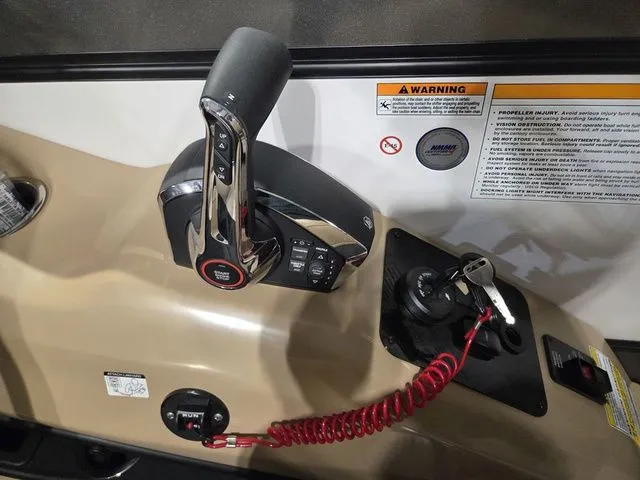 Slide: The Image of Control console of 2026 Barletta Boats Lusso 25UE with throttle and ignition system. - 26
