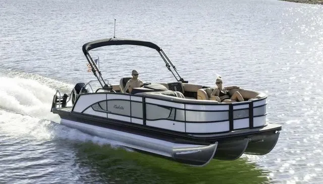 Slide: The Image of 2026 Barletta Lusso 25UE pontoon boat cruising on water. - 37