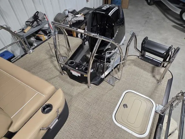 Slide: The Image of Interior view of a 2026 Barletta Lusso 25UE boat with engine. - 6