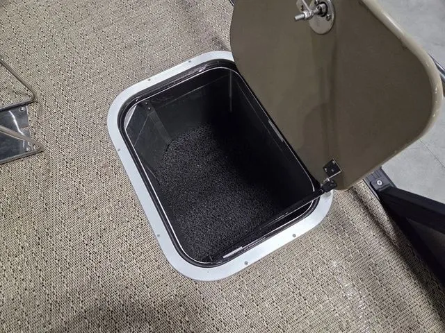 Slide: The Image of Open storage compartment on a 2026 Barletta Lusso 25UE boat. - 7