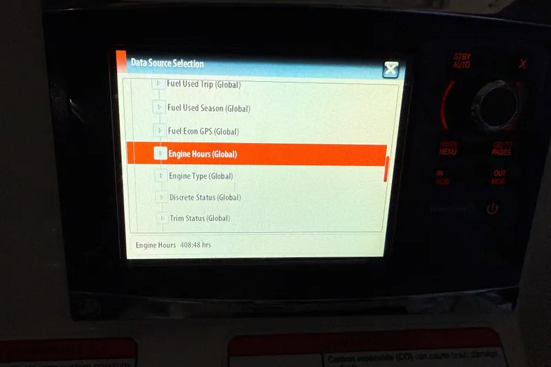 Slide: The Image of Display screen showing engine hours on a 2014 Mako 284 Center Console boat. - 16