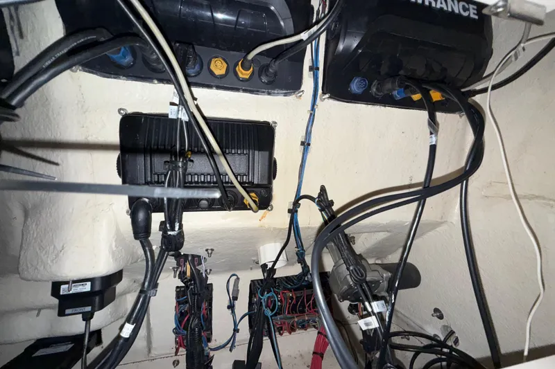 Slide: The Image of Electrical wiring and components inside a 2014 Mako 284 Center Console boat. - 28