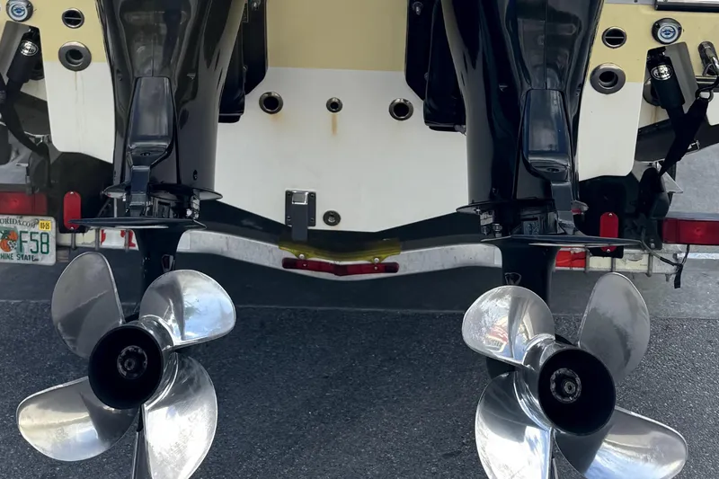 Slide: The Image of 2014 Mako 284 Center Console boat on trailer in covered storage. - 3