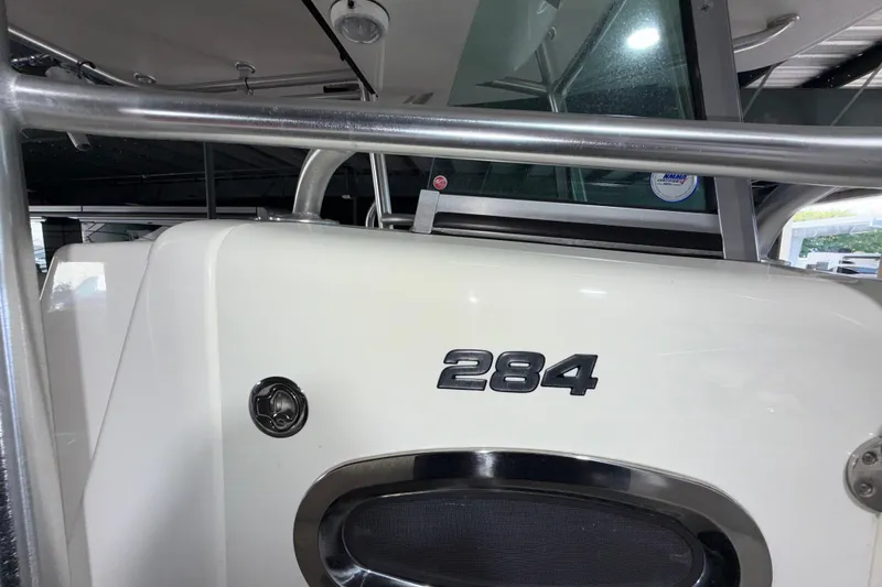 Slide: The Image of 2014 Mako 284 Center Console boat, close-up of model number and console details. - 31