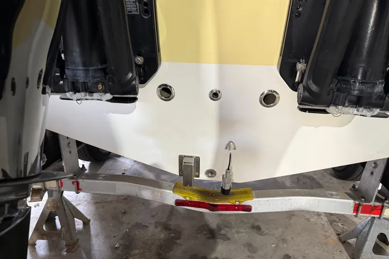 Slide: The Image of 2014 Mako 284 Center Console boat on trailer, showing engine mounts and transom details. - 38