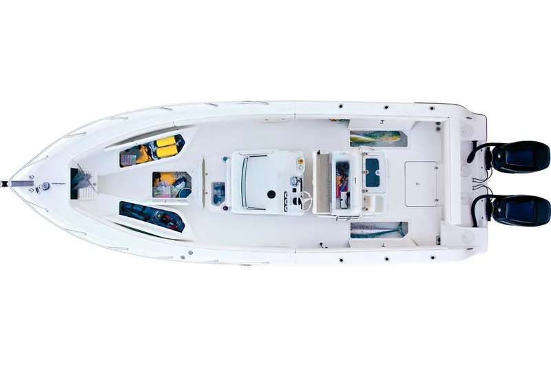 Slide: The Image of 2014 Mako 284 Center Console with dual Mercury outboard engines in a garage setting. - 6