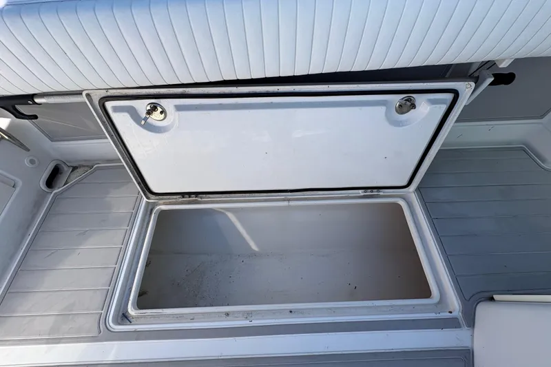 Slide: The Image of Open storage compartment on a 2005 Jupiter 38 FS boat deck. - 37