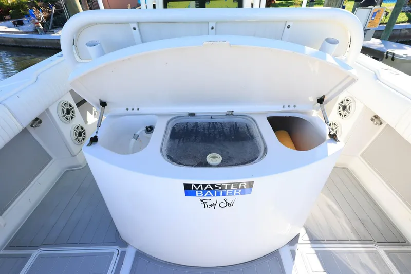 Slide: The Image of Open bait station on 2005 Jupiter 38 FS boat with "Master Baiter" sticker. - 9