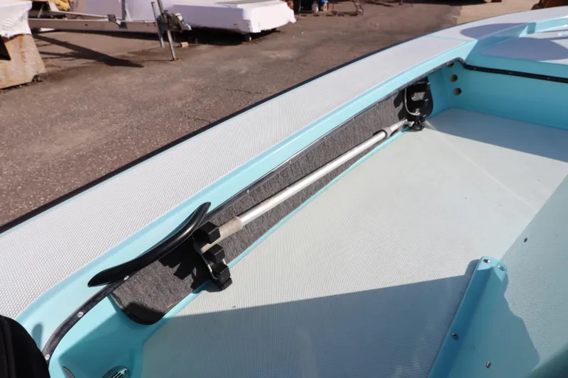 Slide: The Image of 1996 Silver King Signature 16 boat interior with rod holder and light blue accents. - 18