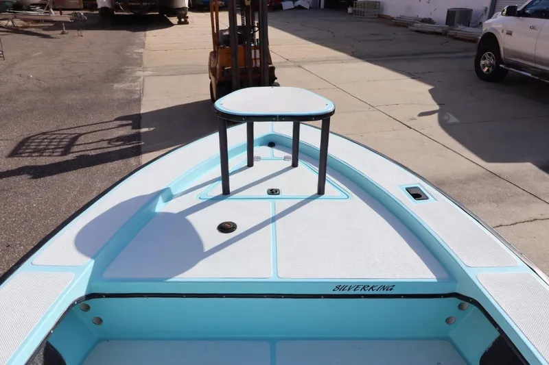 Slide: The Image of 1996 Silver King Signature 16 boat deck in a sunny outdoor setting. - 20