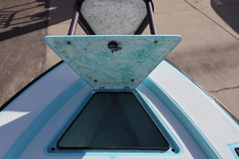 Slide: The Image of 1996 Silver King Signature 16 boat hatch with open lid, showcasing interior storage. - 21