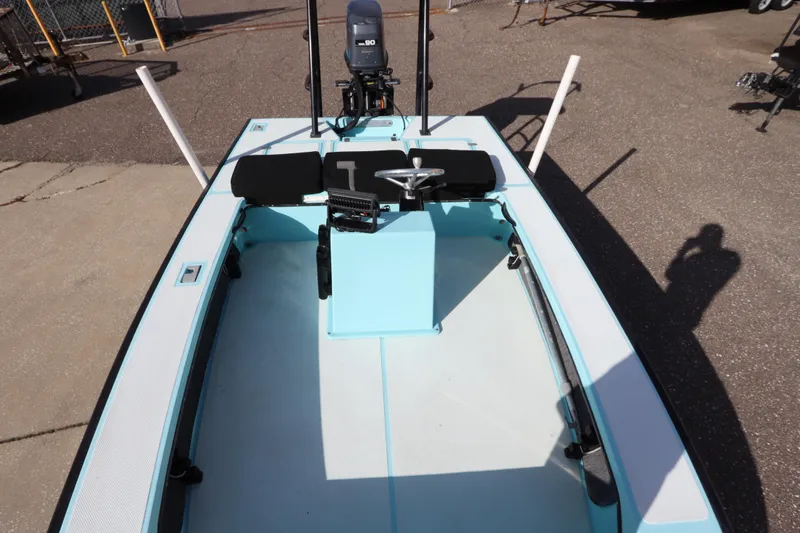 Slide: The Image of 1996 Silver King Signature 16 boat interior with steering wheel and seating. - 22